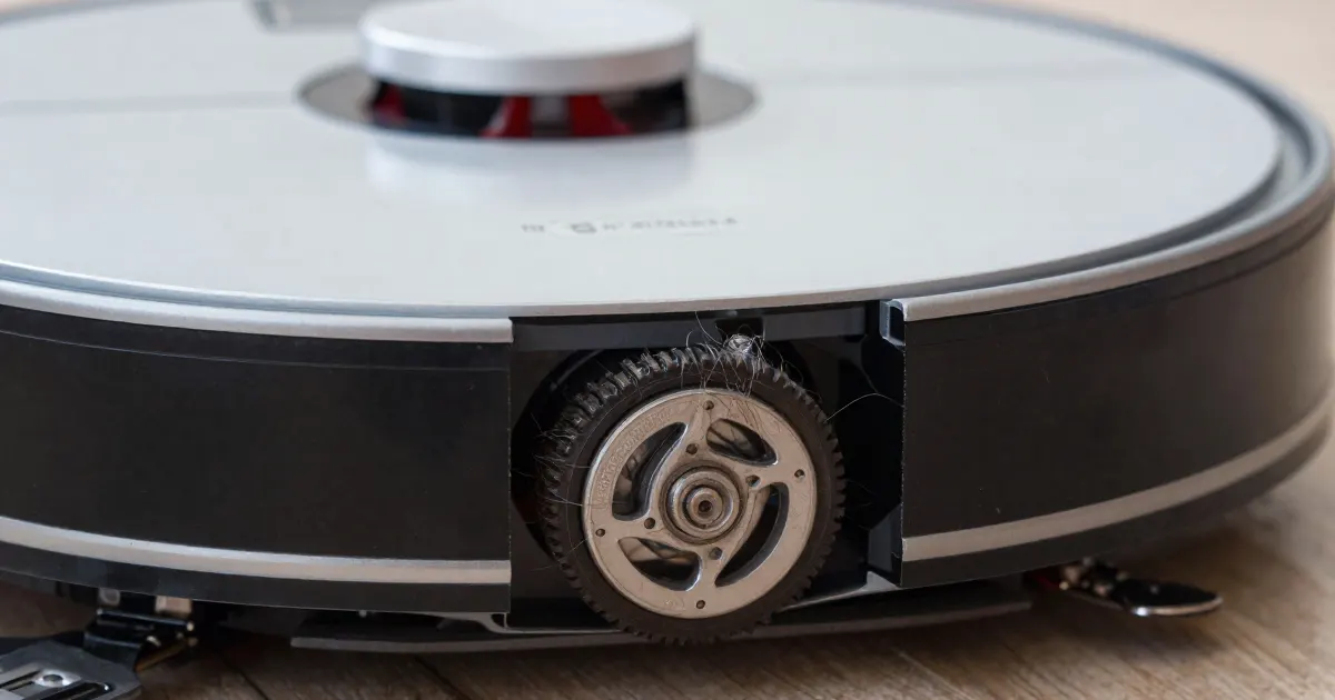 Illustration of a close-up of the drive wheel on the side of a generic robot vacuum