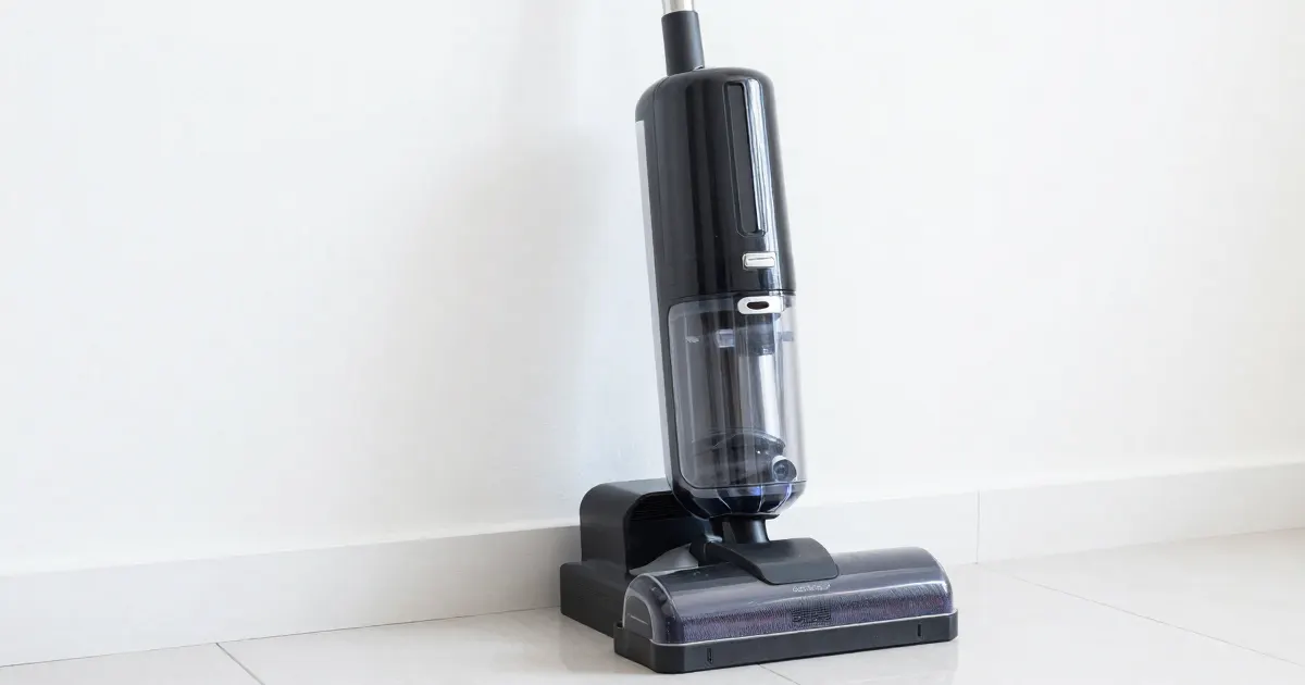 Illustration of a generic cordless floor washer standing in its charging tray against a white wall